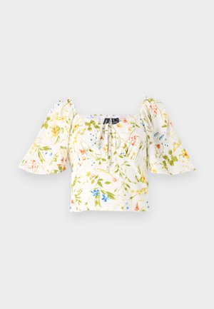 Floral crop top with puff sleeves, features a square neckline, predominantly white fabric with green, yellow, and blue floral patterns.