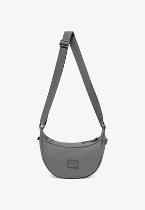 Grey crescent-shaped crossbody bag with adjustable strap and zipper closure, featuring a small rectangular front logo patch.