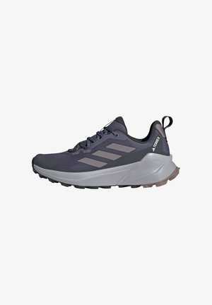 Purple and gray athletic shoe with mesh upper, three stripe design, cushioned sole, textured accents, and reinforced toe cap.