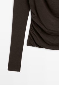 Long-sleeve dark brown ribbed top with ruched detailing on one side, shown against a white background.