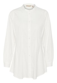 Camicia bianca a maniche lunghe con collo rialzato, chiusura con bottoni e maniche lievemente a sbuffo. Realizzata in tessuto morbido e leggero.