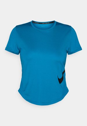 Blue short-sleeve athletic shirt made of smooth fabric, featuring a black Nike logo along the lower left side and a curved hemline.