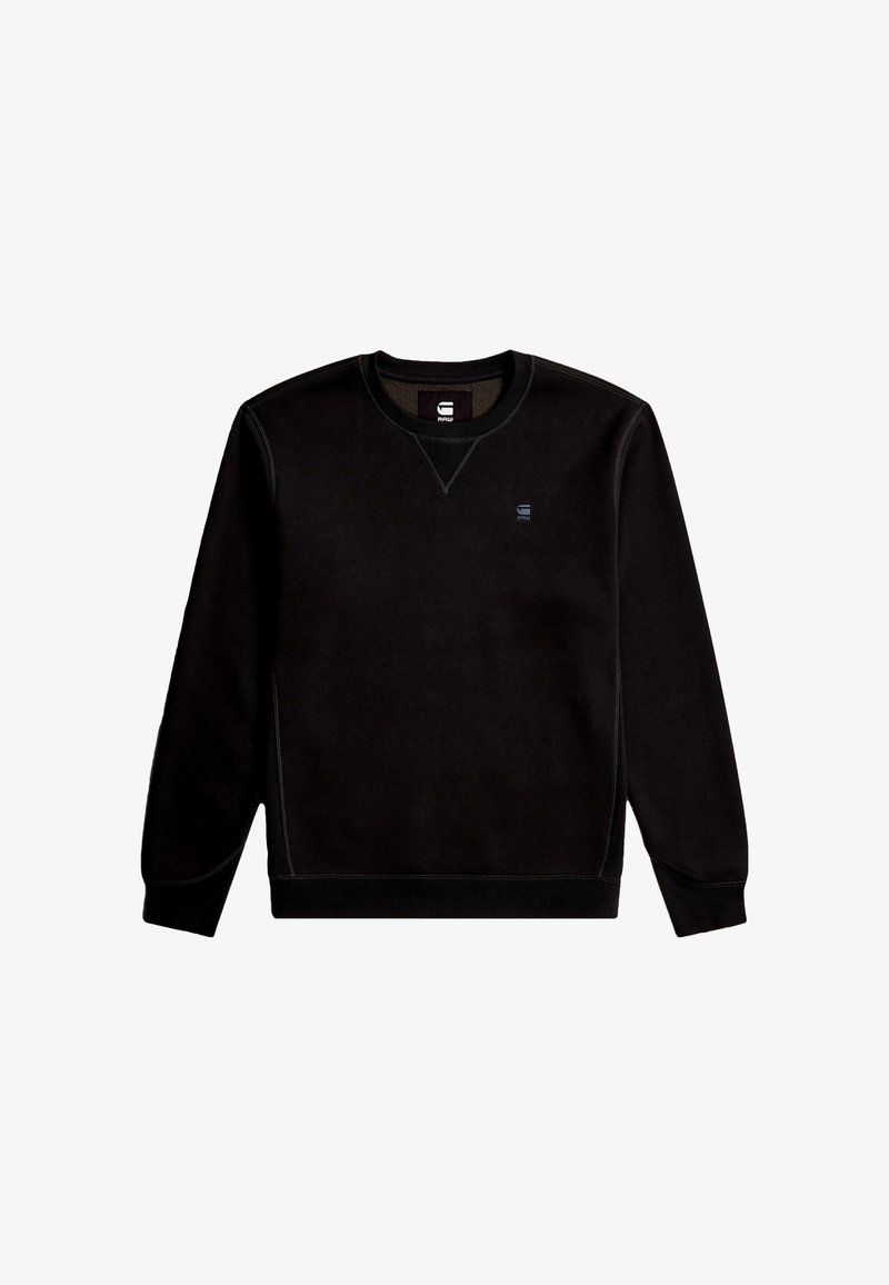 Sweat-shirt noir en tissu doux, avec un col rond, des poignets côtelés et un petit logo sur la poitrine. Texture lisse avec des détails de couture.