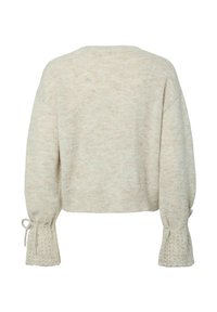 Cropped sweater in light beige, made of soft knit, featuring wide sleeves with lace trim and adjustable ties at the cuffs.