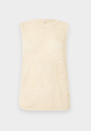 Αμάνικο μπεζ πλεκτό τοπ με στρογγυλή λαιμόκοψη και λουλουδένια σχέδια ενσωματωμένα στο υφασμάτινο ύφασμα.