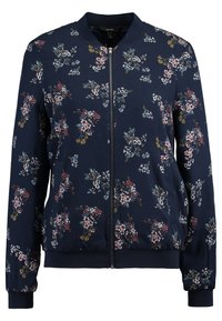 Granatowa kurtka na zamek błyskawiczny z kwiatowym wzorem w kolorach różowym, białym, żółtym i zielonym, z ściągaczami przy mankietach i u dołu.