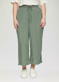 Comfortabele groene wijde broek van lichtgewicht stof, met een elastische tailleband met trekkoord en zijsplitten aan de zoom.