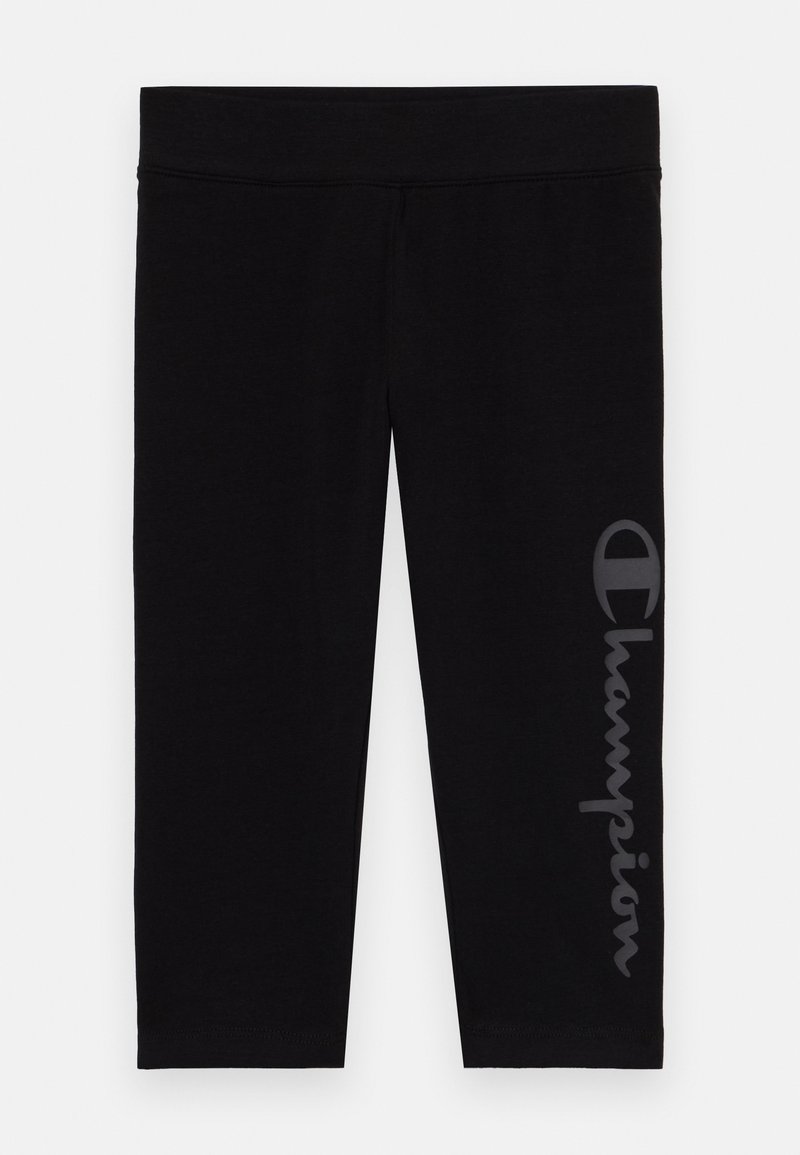 Fekete leggings puha, rugalmas anyagból, elasztikus derékkal. Bal lábszáron fényvisszaverő Champion logó található.