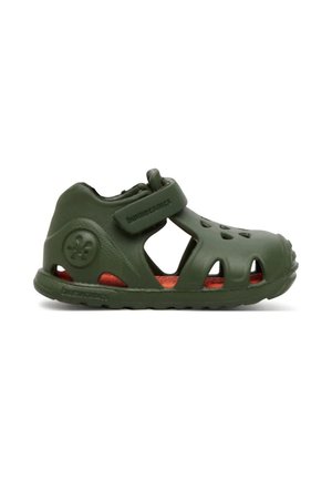 Sandalo verde scuro per bambino piccolo con fori di ventilazione, cinturino regolabile con Velcro e soletta imbottita rossa.