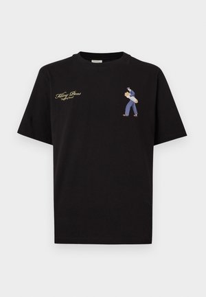 Zwart katoenen T-shirt met korte mouwen, met een geborduurd ontwerp van een persoon die brood draagt en gouden tekst boven de afbeelding.