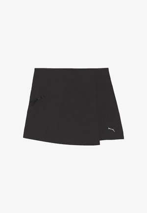 Jupe de sport noire avec petite poche latérale zippée et logo Puma blanc en bas à droite sur fond blanc.