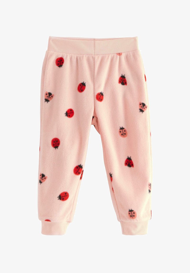 Fleece pyjamasbukser i lyserød, med et mønster af røde marihøner, sorte detaljer og elastisk talje med manchetter.
