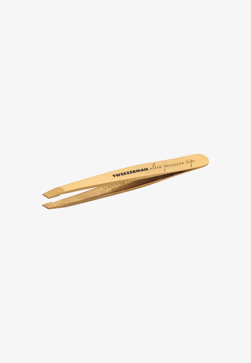 Gold-tone slanted-tip stainless steel Tweezerman tweezers with "ultra precision tips" printed on the handle.