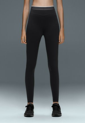 OYSHO, PERFECT-ADAPT HIGH-RISE V-CUT ANKLE-LENGTH LEGGINGS WITH PIPING - Leggings - Trousers - black