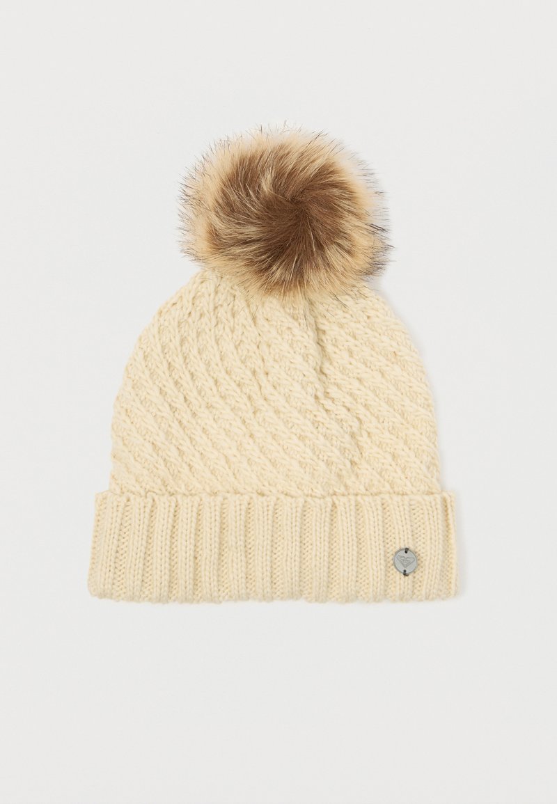 Knit cream beanie with a textured pattern, featuring a brown faux fur pom-pom on top and a small metal accent on the brim.