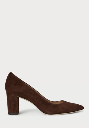 Brown suede high heel pump with a pointed toe design and a block heel. Smooth texture and minimalist silhouette.