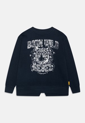 Marinblå sweatshirt med et fremtrædende hvidt tigergrafik med blomsterdetaljer, fed skrift og en spaltet kantdesign. Materiale af bomuld.