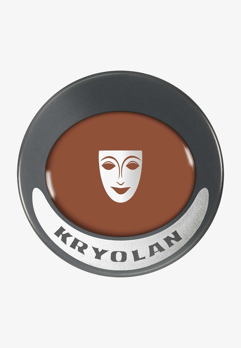 KRYOLAN face paint in a round compact features a smooth, brown texture with a circular black rim and a silver face design on top.