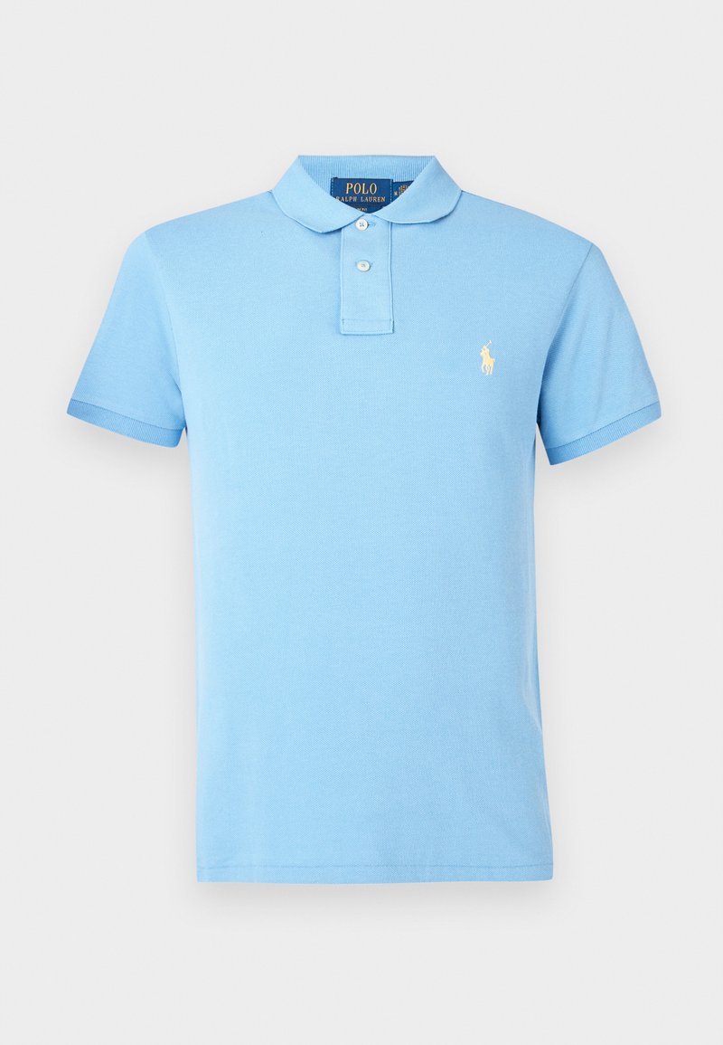 Lichtblauwe polo gemaakt van katoen, met een klassieke kraag en korte mouwen. Geborduurd logo op de linkerkant van de borst. Eenvoudige breistekstuur.