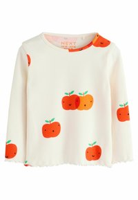 Hvid ribbet langærmet top med et mønster af orange frugter med smilende ansigt og grønne blade, samt en scalloped kantdetalje.