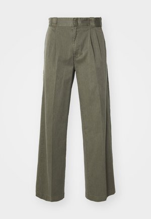 Olive green trousers featuring a loose, wide-leg design with front pleats. Made from textured fabric with a standard waistband and no visible hardware.
