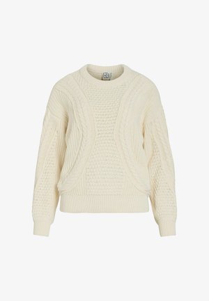 Un pull crème avec un motif tricoté texturé comportant des détails en câble, des manches larges, et un ourlet et des poignets à côtes.