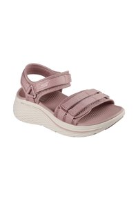 Sandal de color malva claro, con la puntera abierta, dos correas ajustables sobre el pie y una alrededor del tobillo, suela acolchada con textura antideslizante.