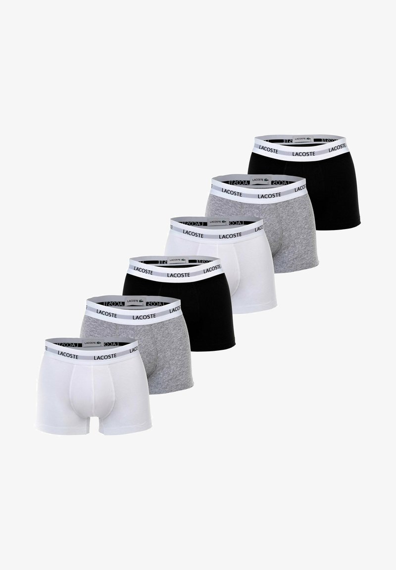 Set di sette boxer in bianco, grigio e nero. Tessuto misto cotone con pantaloni elasticizzati che presentano dettagli con il logo "Lacoste".