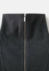 Black wool skirt with a high waist, featuring a silver zipper closure at the front. Smooth texture and tailored design.