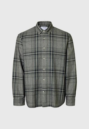 Rutigt knapp-up skjorta i grått med mörk marinblå linjer. Har en krage, långa ärmar och rak fåll. Tillverkad av mjukt tyg.