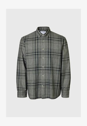 Pelēka kreklu ar rūtiņām, tumši jūras zils. Iekļauj apkakli, garas piedurknes un taisnu apakšmalu. Izgatavots no mīksta auduma.