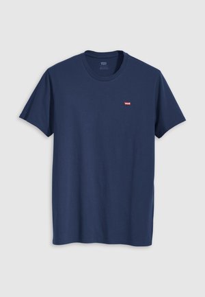 Tumesinine puuvillane T-särk lühikeste varrukatega, ümmarguse kaelusega ja väikese punase Levi'si logoga vasakul rinnal. Sile tekstuur, regulaarne lõige.