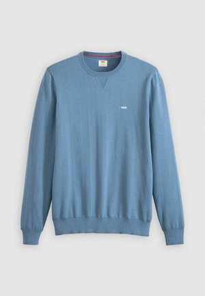 Light blue sweater made of smooth fabric, featuring a crew neck, long sleeves, and a logo on the chest. Ribbed cuffs and hem.