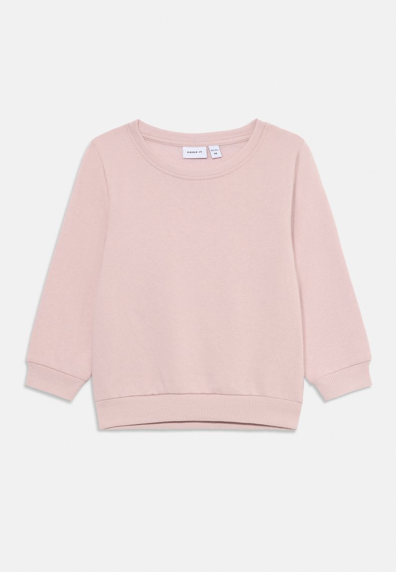 Felpa rosa chiaro con scollo rotondo, maniche lunghe e polsini e orlo a costine. Tessuto morbido con una consistenza liscia.