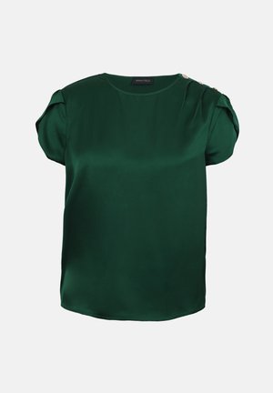 Blouse vert foncé à manches courtes avec encolure ronde, manches bouffantes froncées et boutons décoratifs sur une épaule.