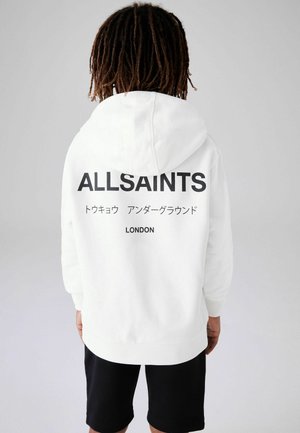Valkoinen huppari, jossa on suuri musta "ALLSAINTS" -logo selässä, mukana myös japaninkielistä tekstiä ja "LONDON". Pehmeä kangas, rento muotoilu.