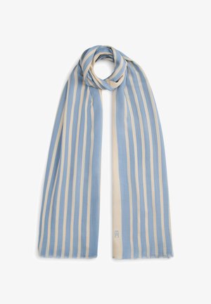 Gaiši zilas un krēmkrāsas svītraina šalle ar mīkstu, teksturētu audumu; vienā stūrī ir logotipa detaļa un plānas malu frizes.