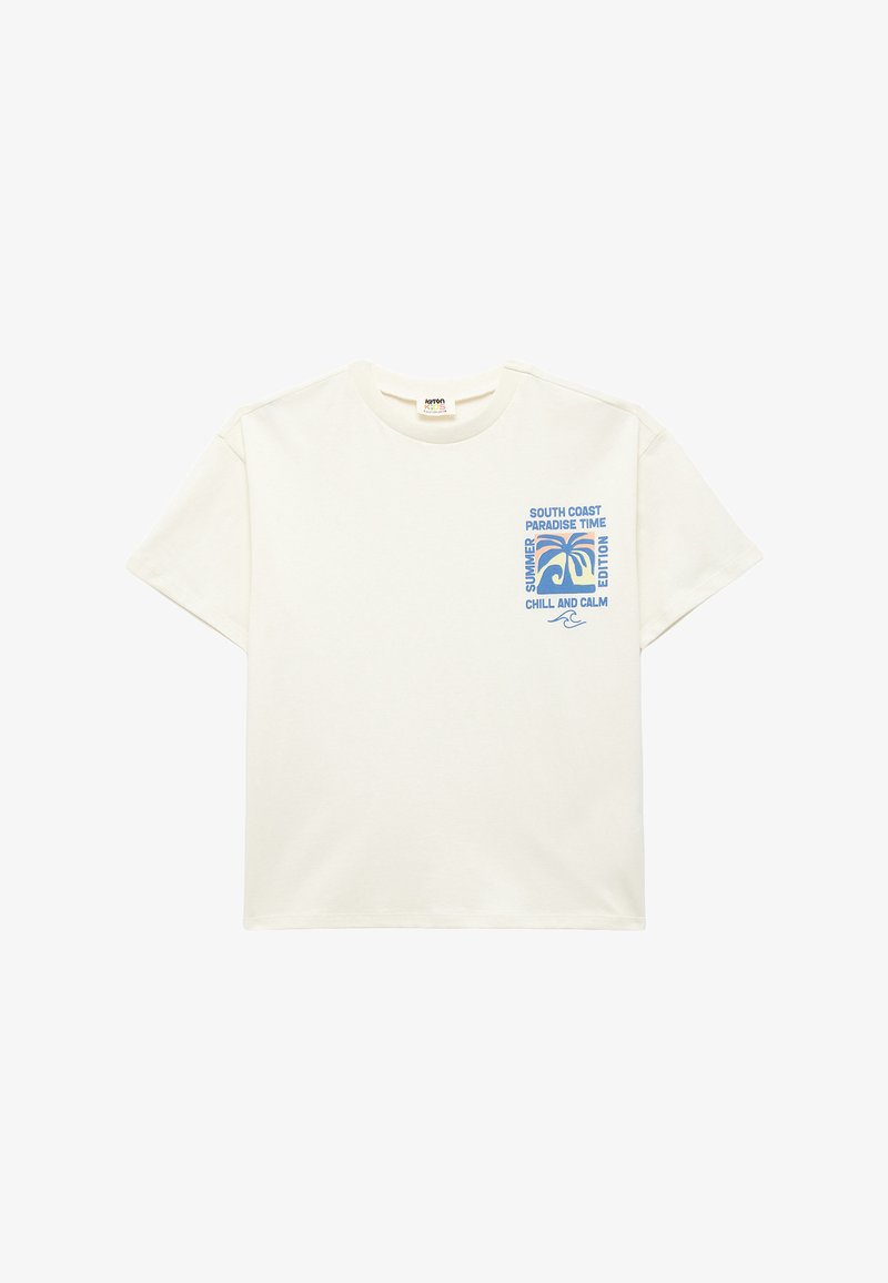 Cremefarvet t-shirt med korte ærmer og et blåt print med palmer og tekst, herunder "SOUTH COAST" og "SUMMER EDITION."