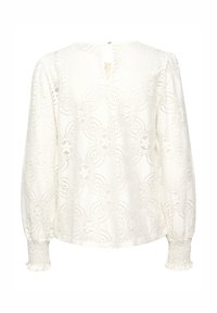White lace blouse with floral pattern, puffed long sleeves, and smocked cuffs. Keyhole back closure. Textured lightweight fabric.