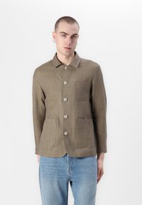 Brown linen shirt jacket with a collar, front buttons, and two large patch pockets. Textured fabric, casual design, and a modern fit.