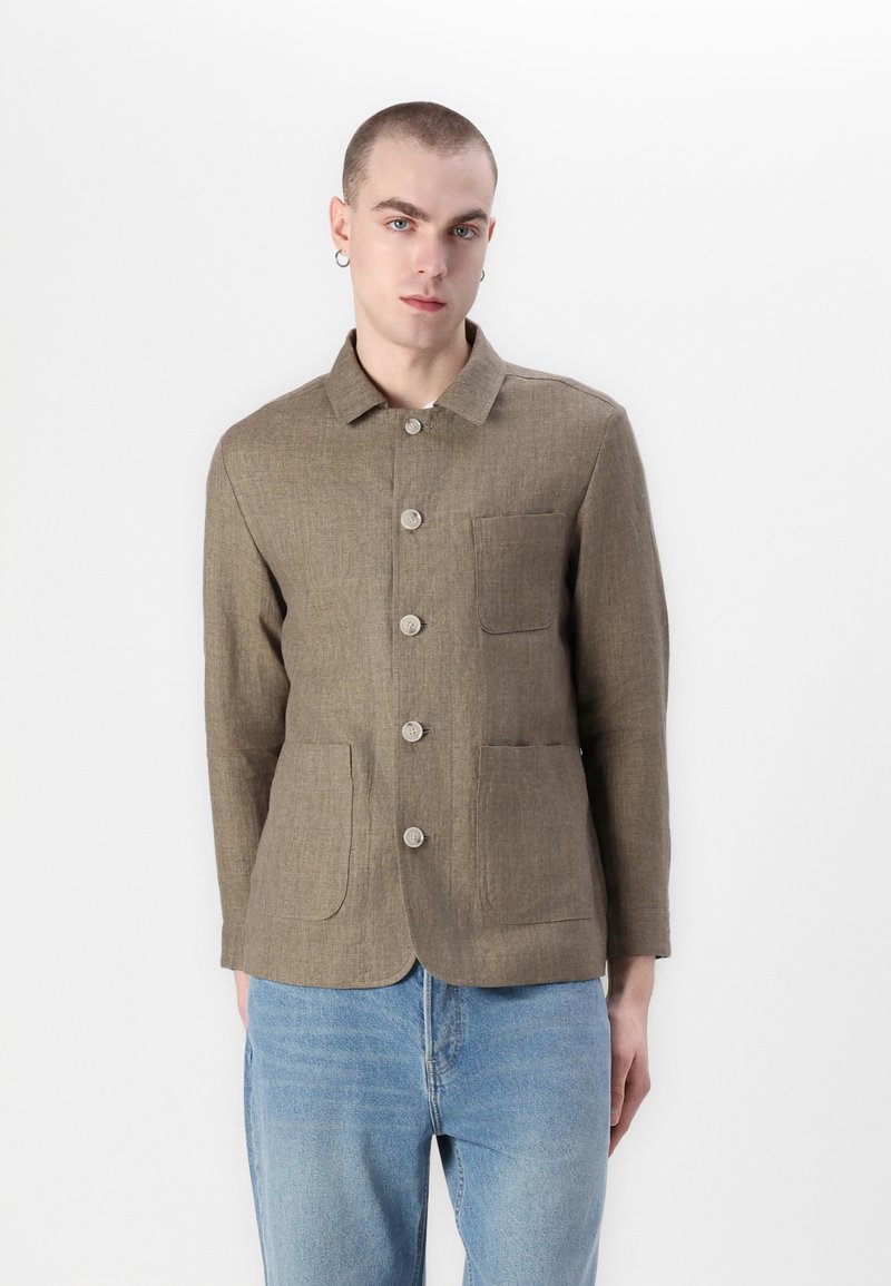 Brown linen shirt jacket with a collar, front buttons, and two large patch pockets. Textured fabric, casual design, and a modern fit.