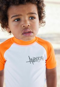 Next SUNSAFE SET - REGULAR FIT - Jogginghose - orange checkerboard