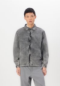 Gray denim jacket with a button closure, spread collar, and elastic cuffs. Features a faded wash and straight fit design.