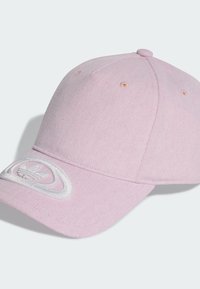 Pink corduroy baseball cap with a curved brim, featuring a white embroidered logo on the front and visible stitching details.