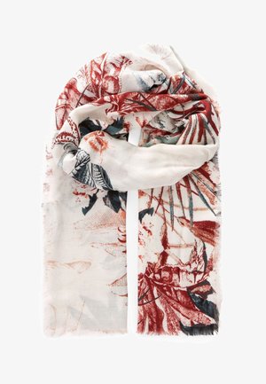 Écharpe crème claire avec imprimé botanique rouge, noir et orange, pliée de manière lâche avec des bords effilochés sur un fond blanc.