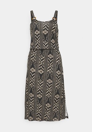 Schwarz-beige gemustertes Kleid mit tailliertem Oberteil, Spaghetti-Trägern und einzigartigen bernsteinfarbenen Hardware-Akzenten. Mit einem seitlichen Schlitz.