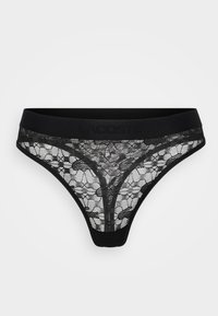 Black lace thong with a wide black waistband featuring embossed "Lacoste" logo, floral and mesh patterns, V-shaped design, and thin sides.