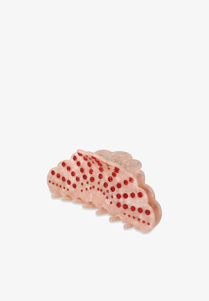 Clips de pelo de acrílico rosa con un diseño de ola, adornados con piedras rojas y doradas, acabado texturizado y múltiples púas de agarre.