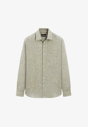 Lys grøn langærmet skjorte med knapper lavet af tekstureret stof. Har en brystlomme og en klassisk krave med knaplukning.