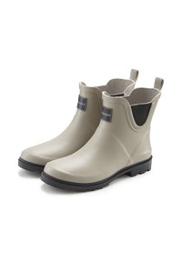 Khaki rubber ankle boots with a smooth finish, black soles, exposed stitching, and rear pull tabs for easy wear. Black accents on the sides.
